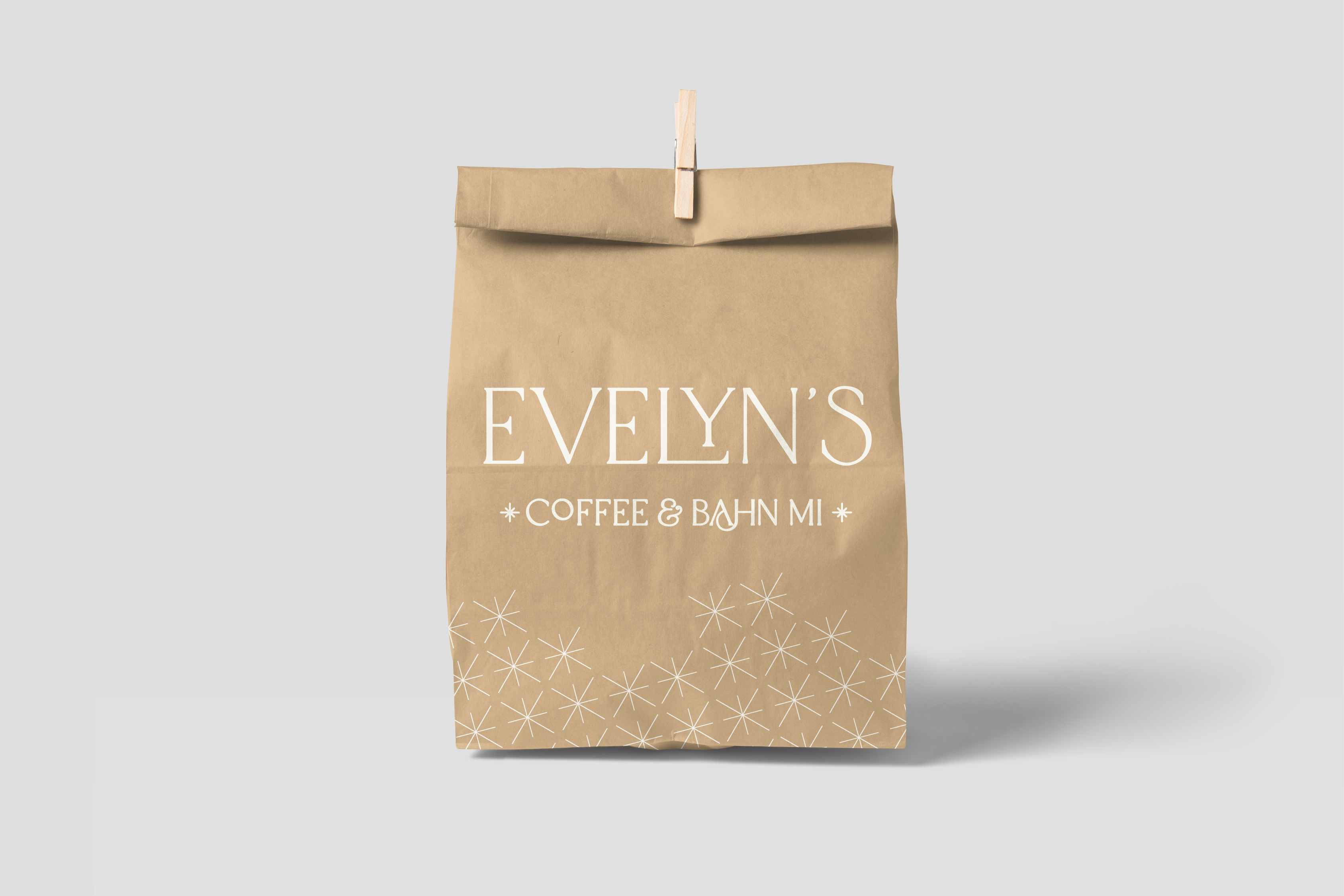 a craft paper bag, printed with cream-colored text and patterning.